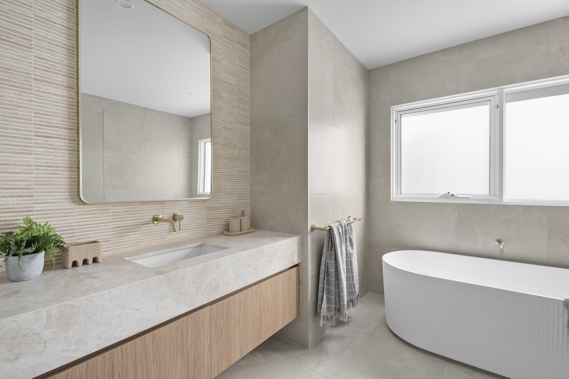 Main bathroom with freestanding bath and vanity