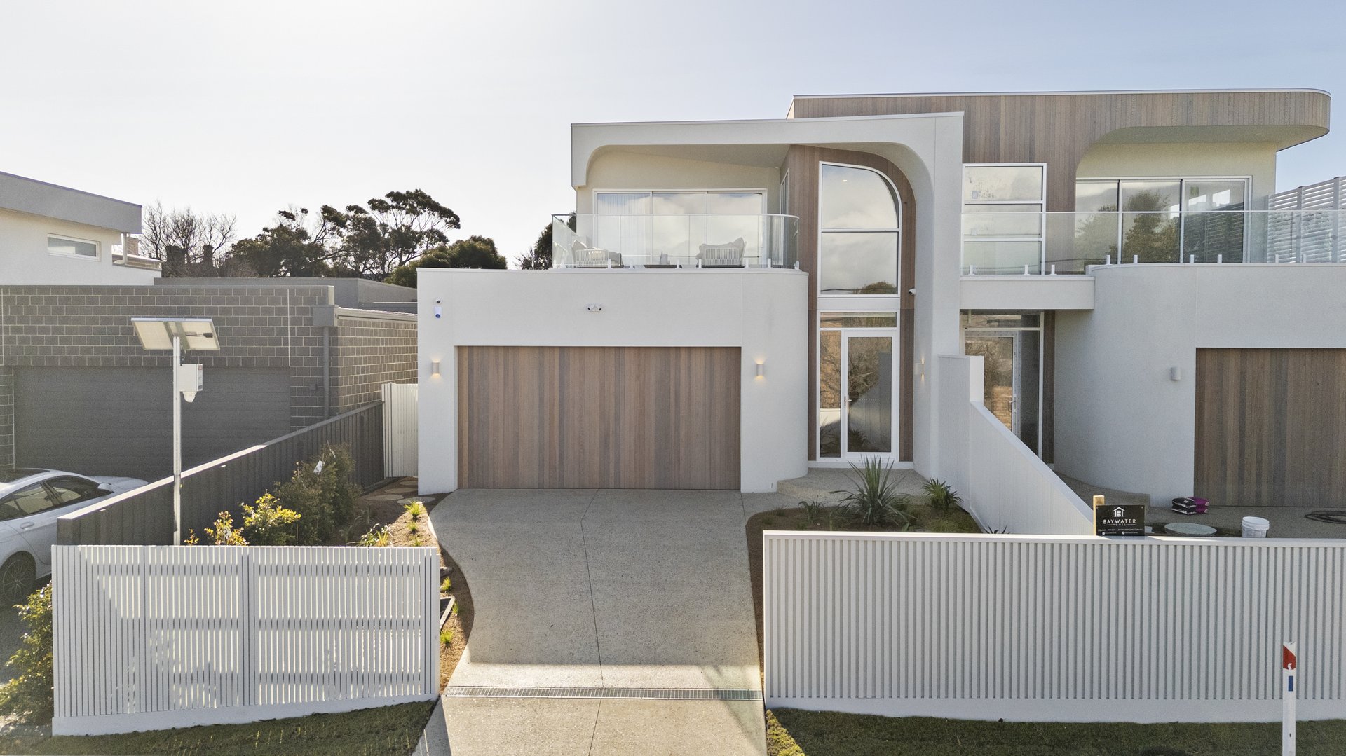 Elevated view of the front façade and driveway at Williams Road