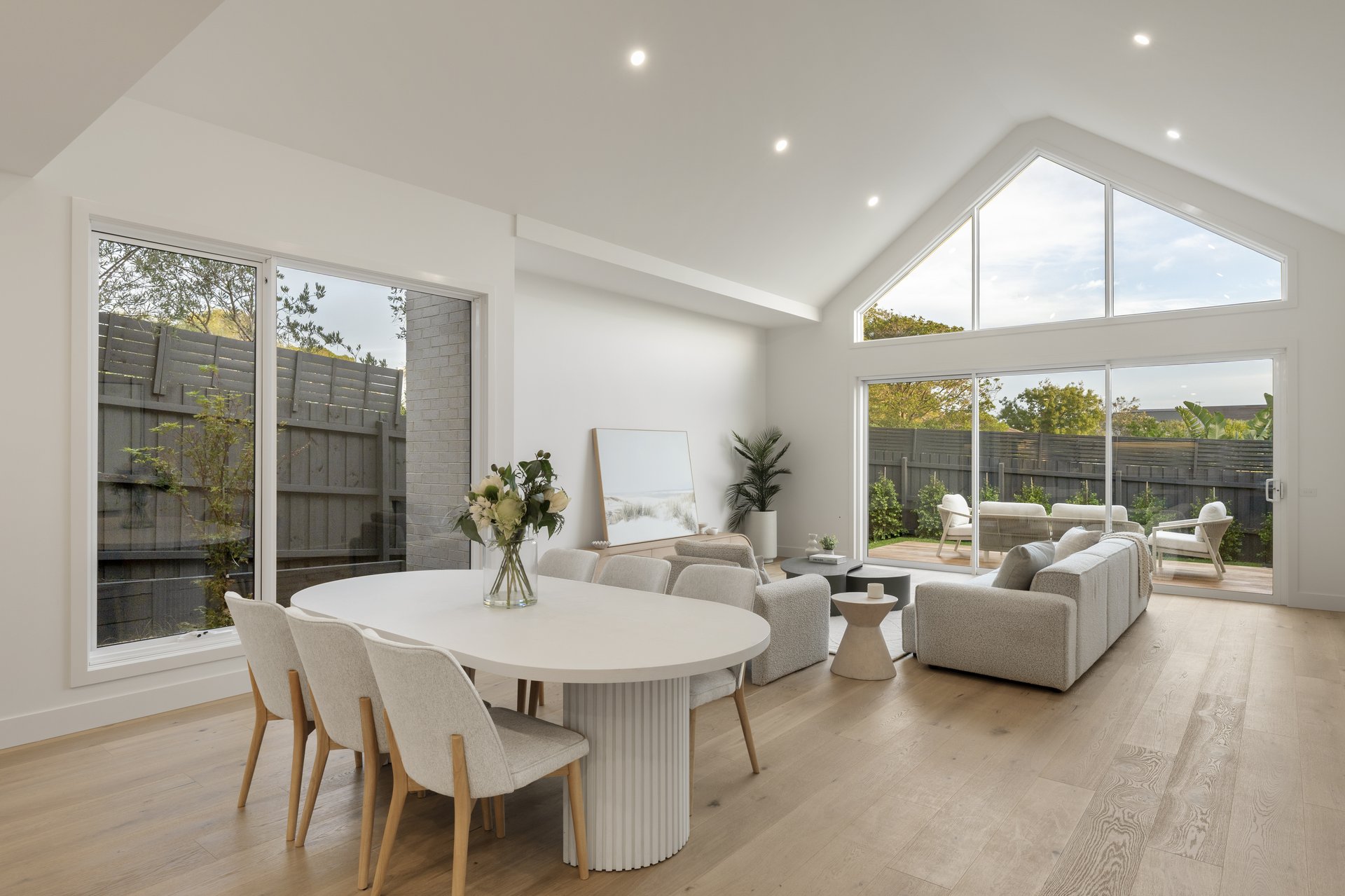 24A Ti-Tree Grove — living and dining with cathedral ceiling