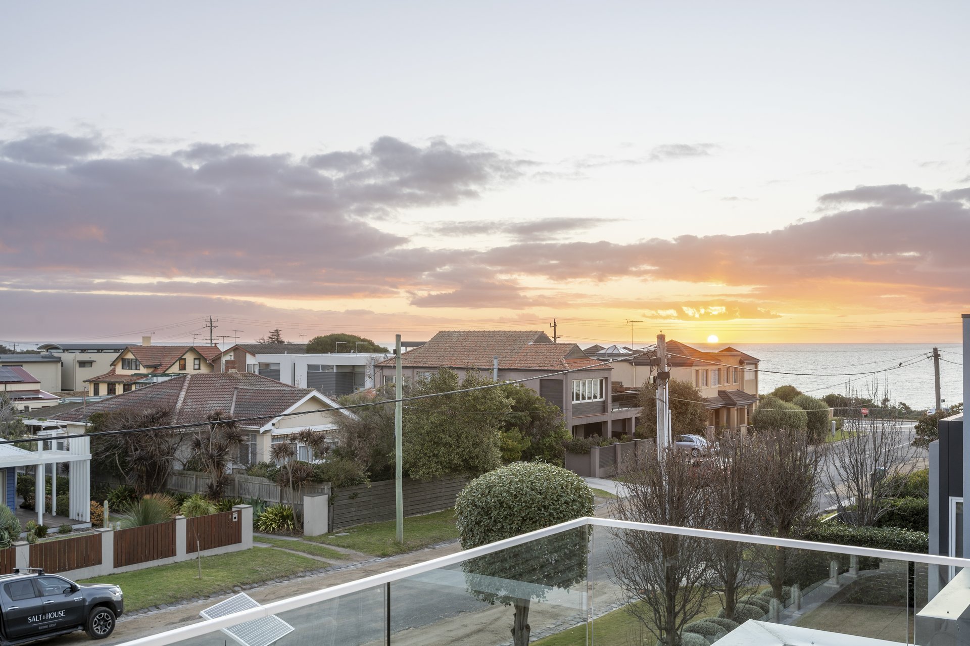 Balcony outlook toward the bay at sunset