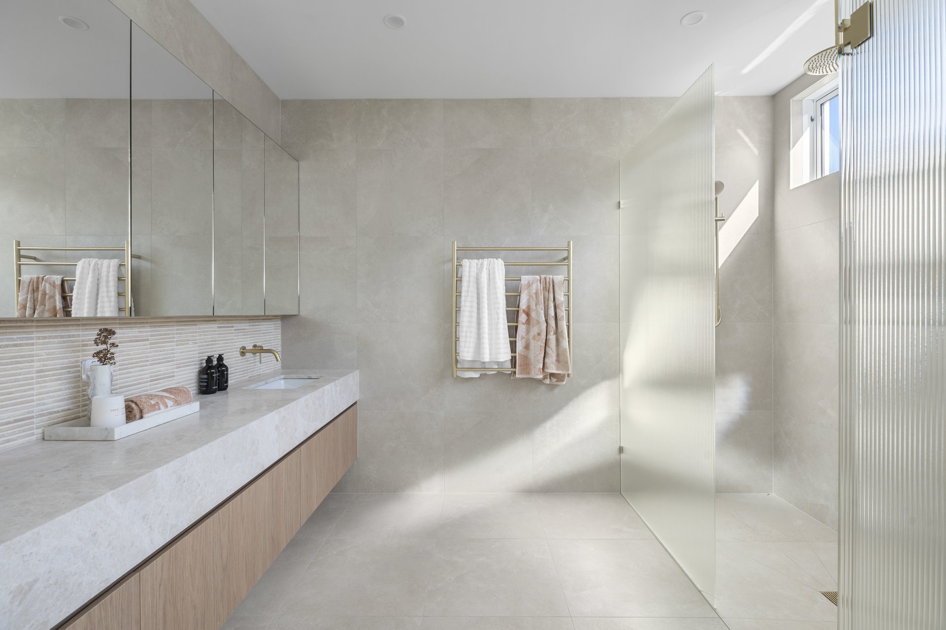 Master ensuite with double vanity and fluted glass shower