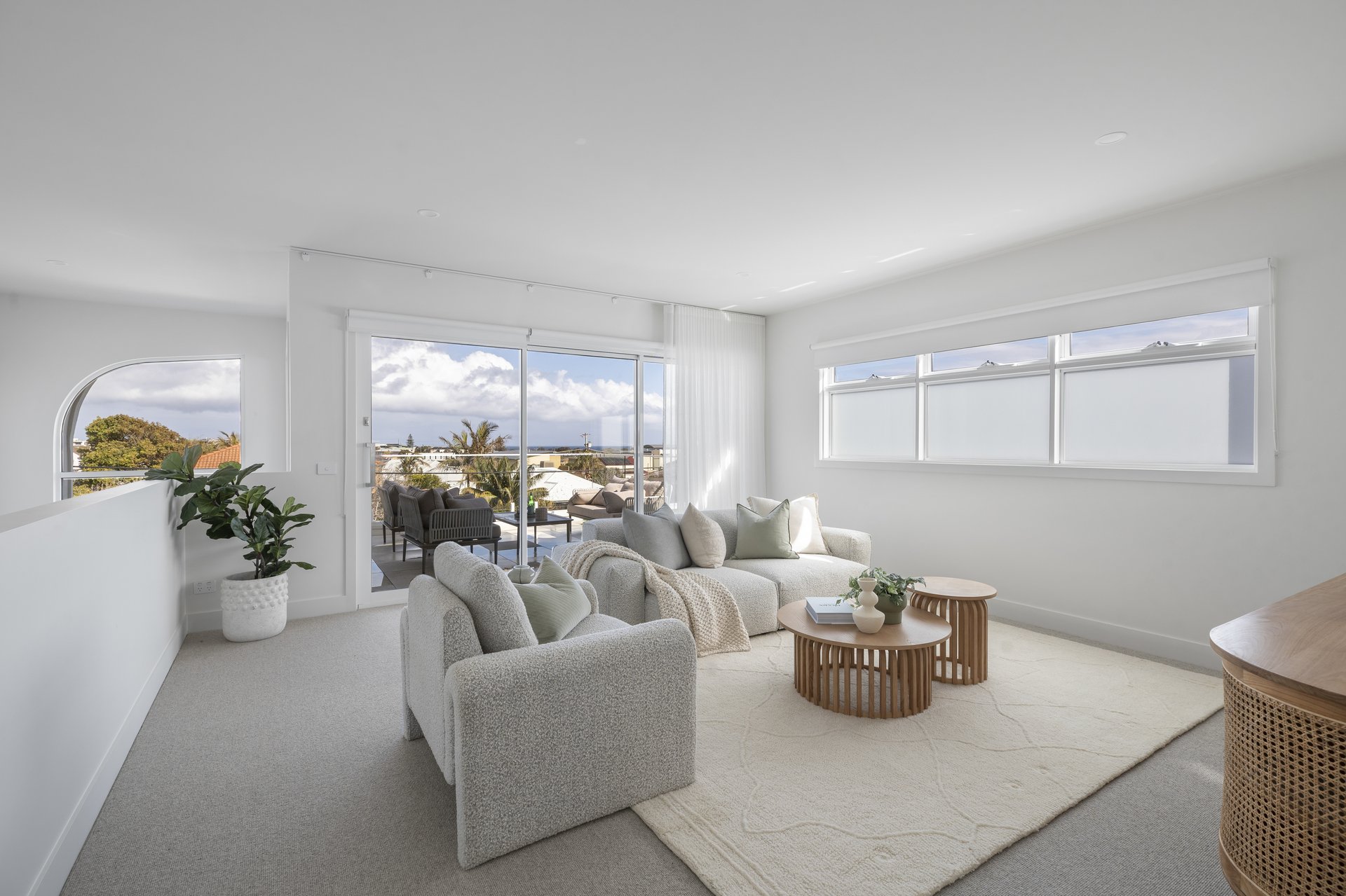 Upstairs living zone opening onto the balcony