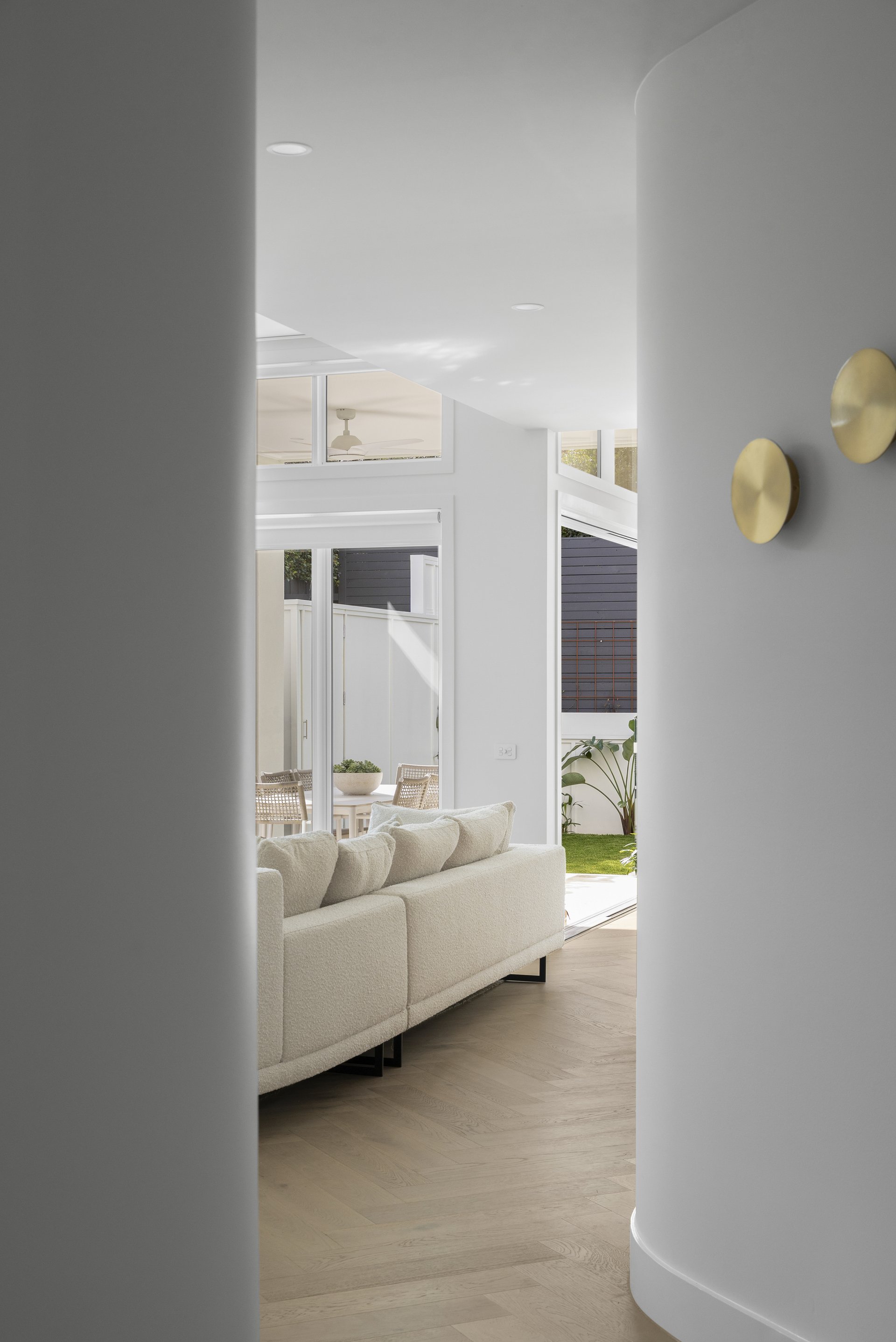 Curved hallway opening through to the living area